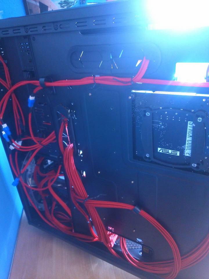 the back side of my pc with all the wiring custom sleeved all the fan/front panel cables myself with E22 sleeving and cable tie's