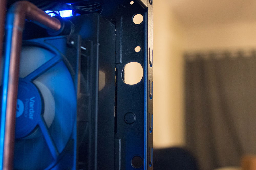 Mounting hole, the end cap fits invisibly behind the front panel of the case.