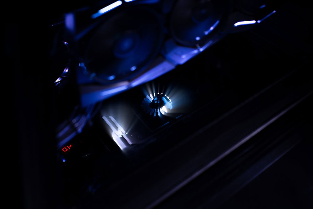 Look down into the case, the 32GB G.Skill RAM and GamerStorm AIO reflect into the black glass on the cases's floor.