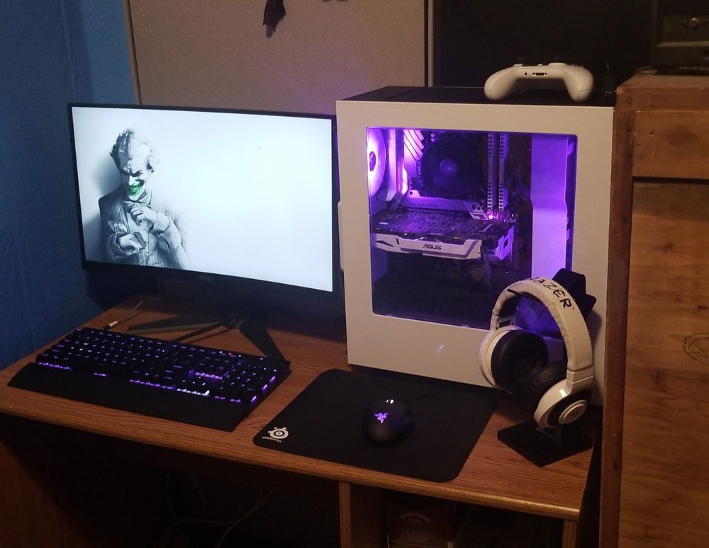 Went with purple lighting because I love how the white components capture and disperse the lighting effects. Background is the Joker because he is my favorite villain, and the purple accents in the PC, and the slight green on the background subtly add the feel of a Joker-esque theme