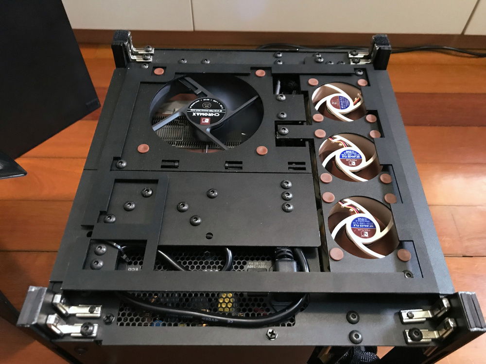 Removing the dust filter reveals the top removable panels:
- CPU top exhaust fan (Top left) (Noctua NF- S12A)
- Drive Bay (Middle left)
- GPU exhaust fan (Right) (3x Noctua A6 x25)
- The PSU mount (bottom) is non-removable.