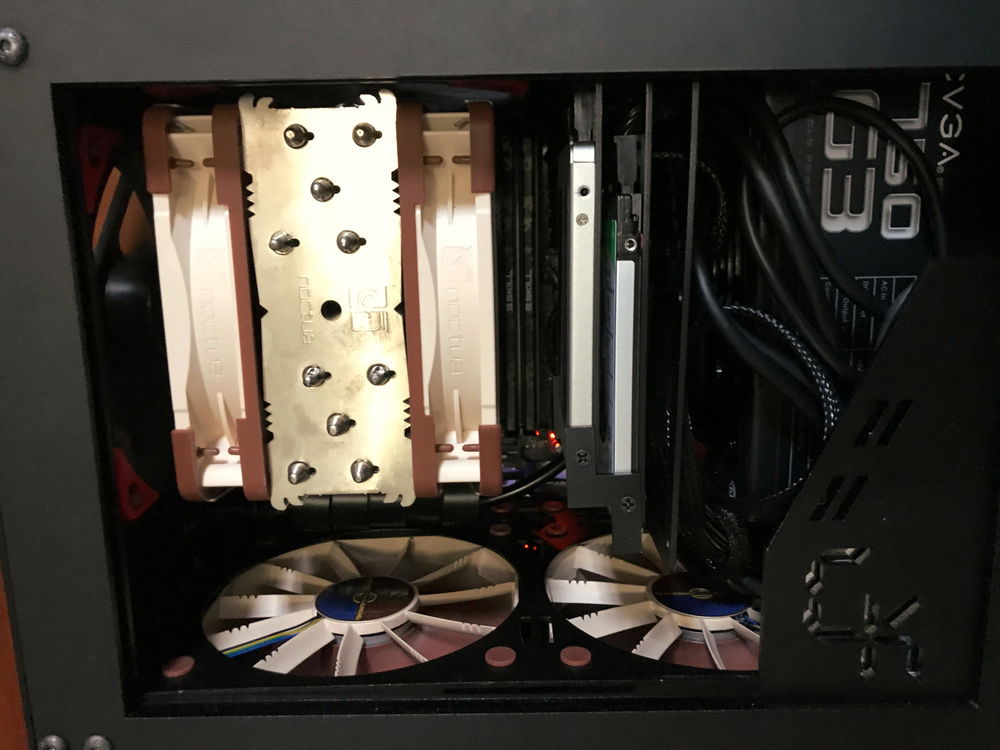 The main compartment hosts:
- The Motherboard (Left)
- 2.5" Drives (Middle)
- PSU (Right)

Two of the NF-F12 intake fans blow fresh air directly into these components.