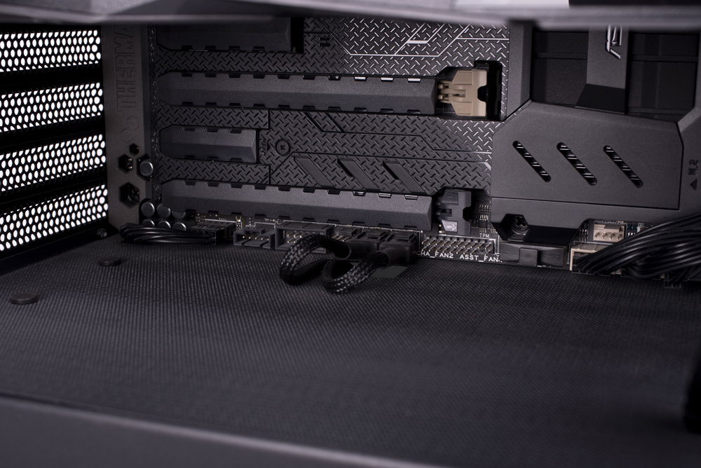 Cable management under the MB. Case was drilled and cut, painted, covered with mesh, that was also cut to match the case's new holes.