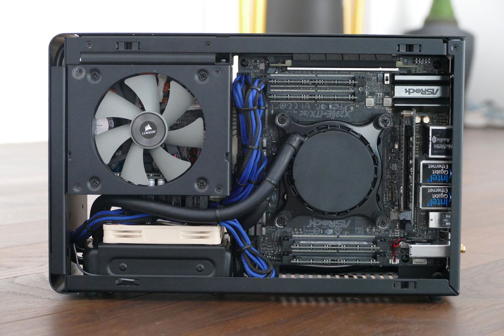 Open Case, Motherboard Side
Left-Top: Corsair SF600
Left Bottom: Asetek 545LC with Noctua A9x14
Right: AsRock X299e-ITX/ac with Intel Core i7-7980XE
Cables: CableMod Custom Length PSU/4Pin CPU (thx@Matt)
New Black ADT Riser for Dan A4