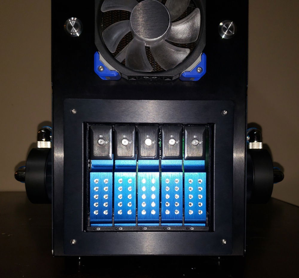 Dual EK D5's on custom panel mounts. ISTARUSA 5 drive hotswap bay.