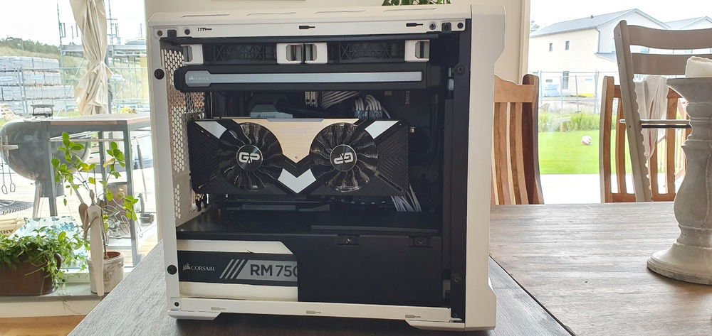 Had to redo the entire build to convert it to fit a 2,5 slot RTX 2080ti card. Vertically mounted