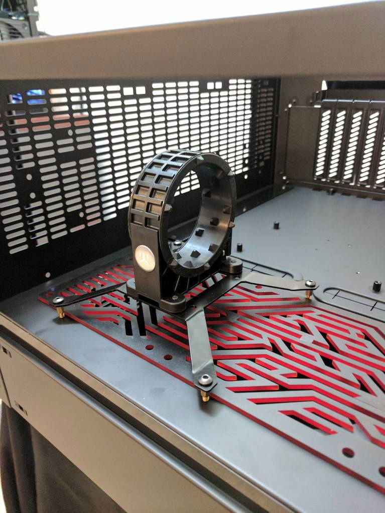 I mocked up the assembly for the pump. I'm using a 140 fan bracket because I didn't want to be limited by the fans for pump placement. I also wanted to clear the custom fan grill.

I used some old motherboard standoffs to clear the fan grill. I want to be absolutely sure everything is centered.