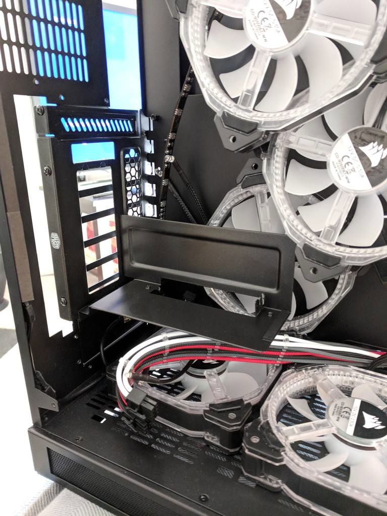 The Lian Li PC-O11 WGX comes with a bracket and PCIe riser cable to mount your GPU vertically to the floor of the case, but if you have fans or radiator on the bottom of the case, you can't mount it there.  

I really wanted to have the card vertically, with fans and a rad on the bottom.  

 

I made a custom mount for my card using some acrylic and a PCIe bracket, but when I got my new Mobo and CPU i decided to go with the Coolermaster vertical GPU mount.