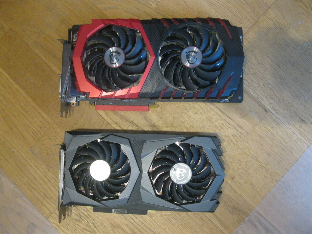 MSI GTX 1060 Gaming X 3G (old GPU) next to MSI GTX 1660 Ti Gaming X 6G (new GPU) for size comparison.