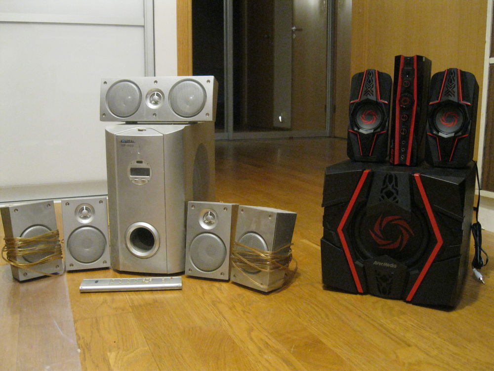 New 2.1 speakers next to old 5.1 speakers.
