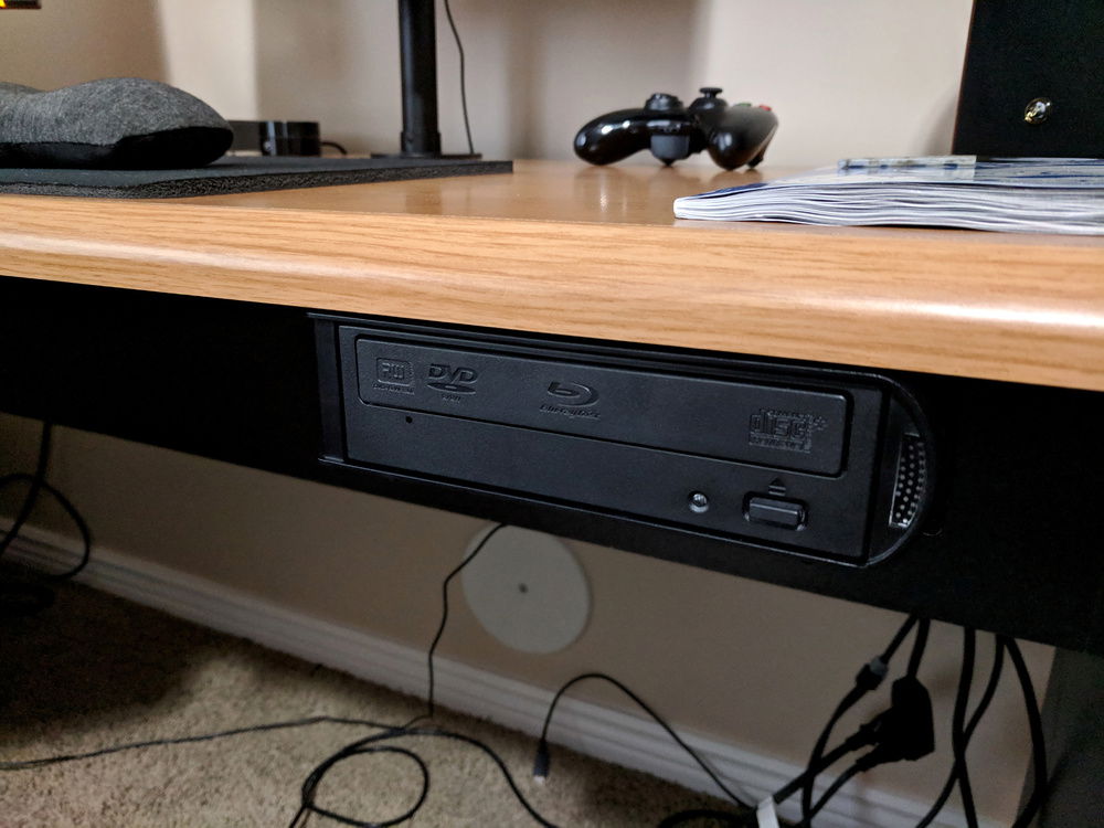 Mounting the optical drive under the desk.