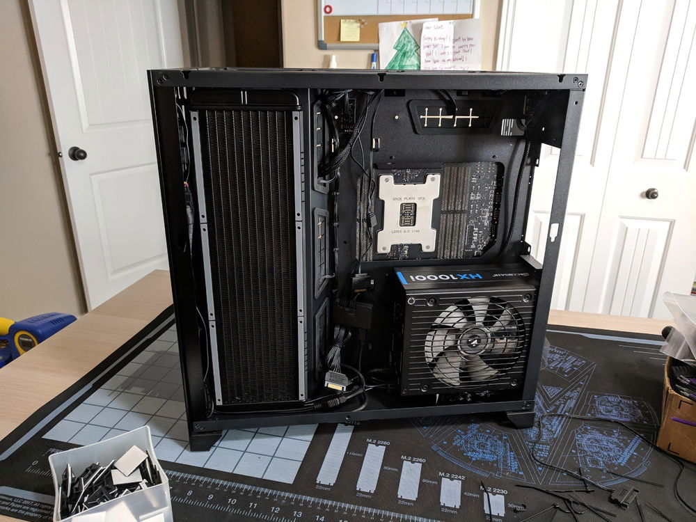 Rear cable management almost done. It's not perfect, but it's not bad considering there are nine RGB fans installed.