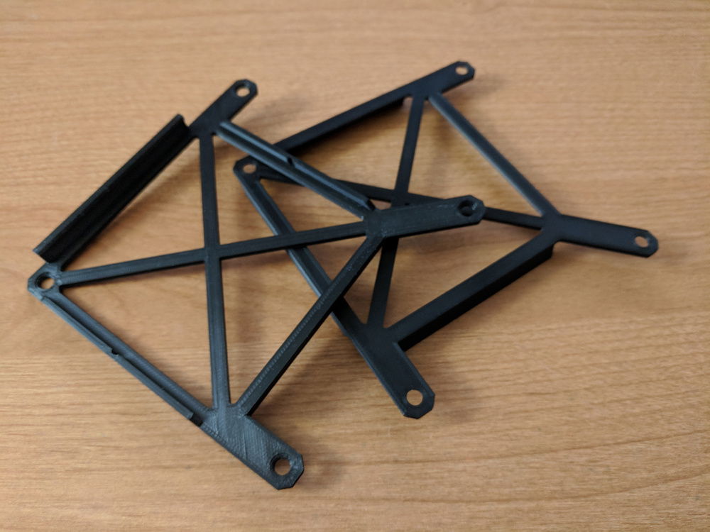 The 3D printed Cryorig C7 120mm fan brackets.