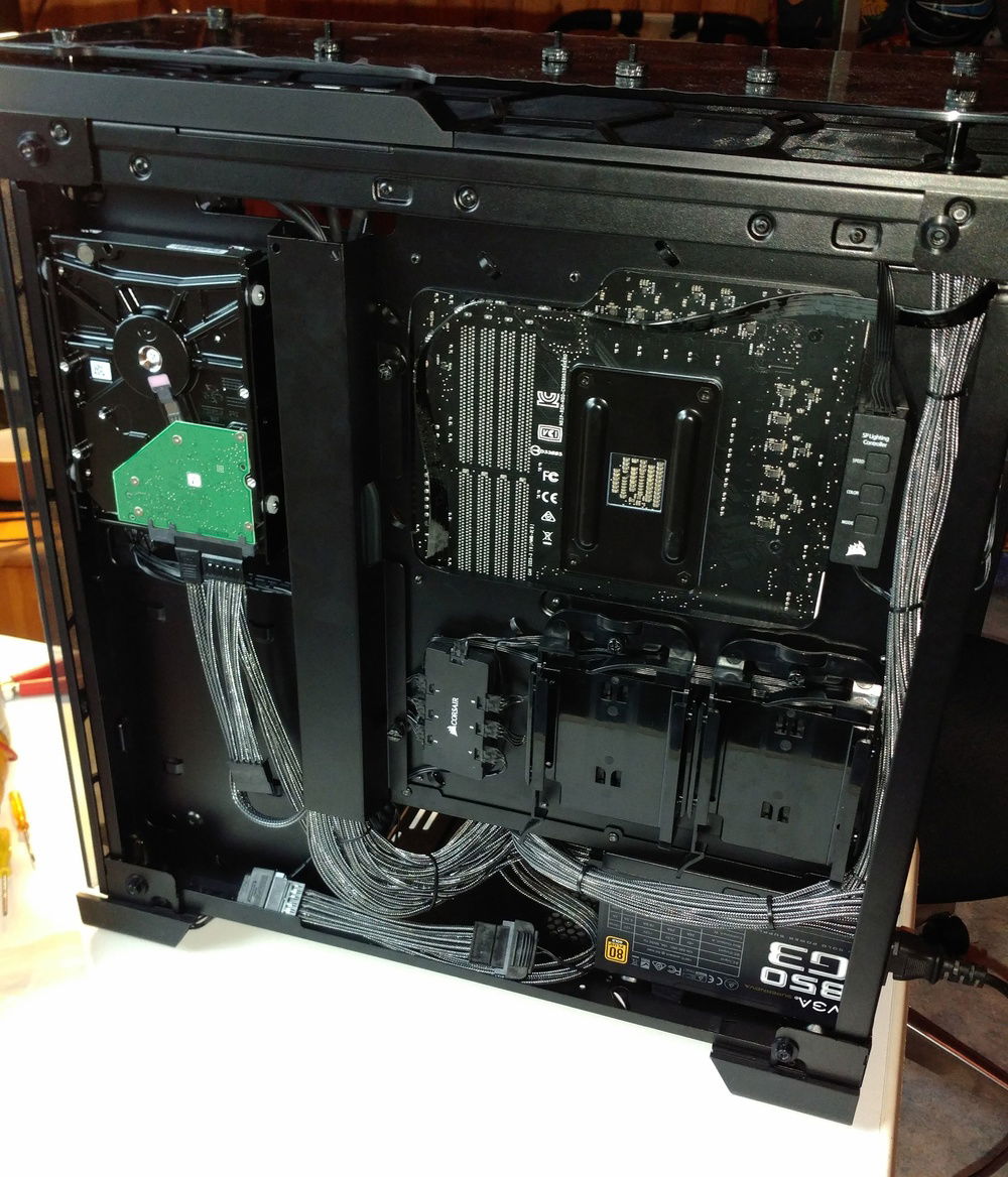 The back of the case, though hidden by some furniture is still Tempered glass and was done with great care (2.0 in this picture)