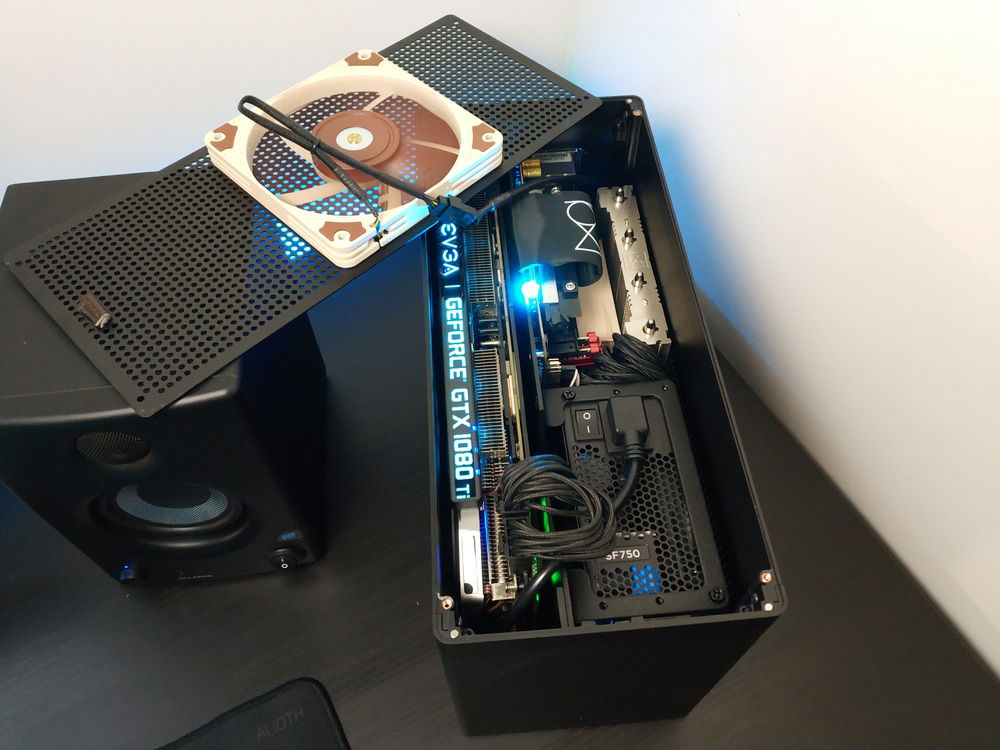 OLD PHOTO.

I used double sided tape to stick the fan to top-cover. This-way I there is more airflow through the case. Planning to add one more fan and reduce the RPM a little...