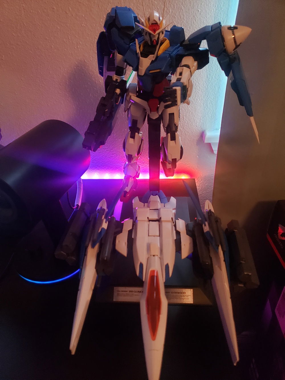 Every desk has to have a Gunpla! Here's my Perfect Grade Gundam 00 Raiser - official preorder stand enroute... I am a big fan of Destiny/Seed, 00 and Unicorn. Soon I'll also have a Perfect Grade Strike Freedom or Exia LED.