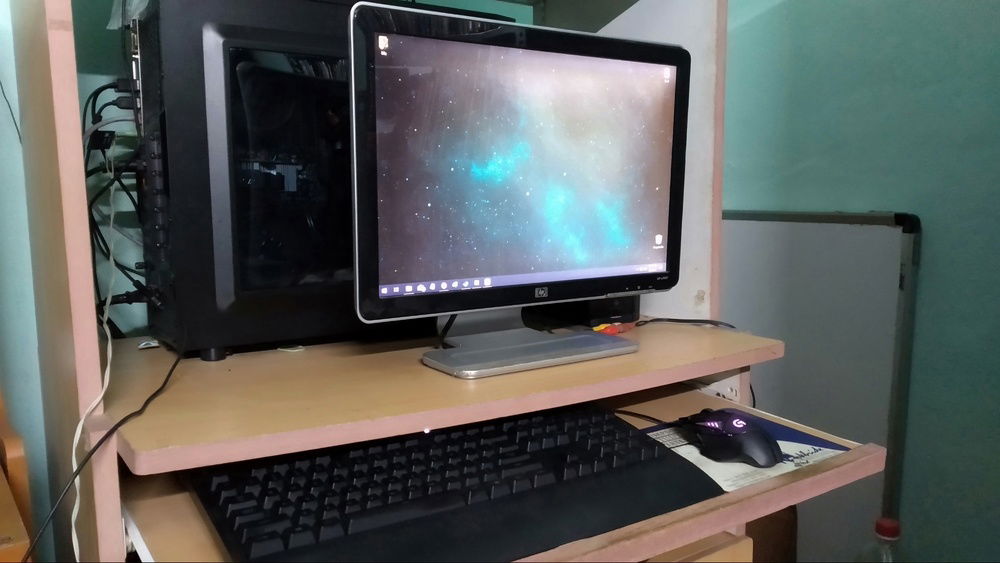 I have quite a small desk. I put it like that so that I could see the shiny lights inside (1 RGB strip that I got for cheap from amazon).