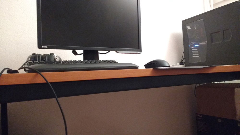 The cables are (mostly) hidden in the frame of the desk.