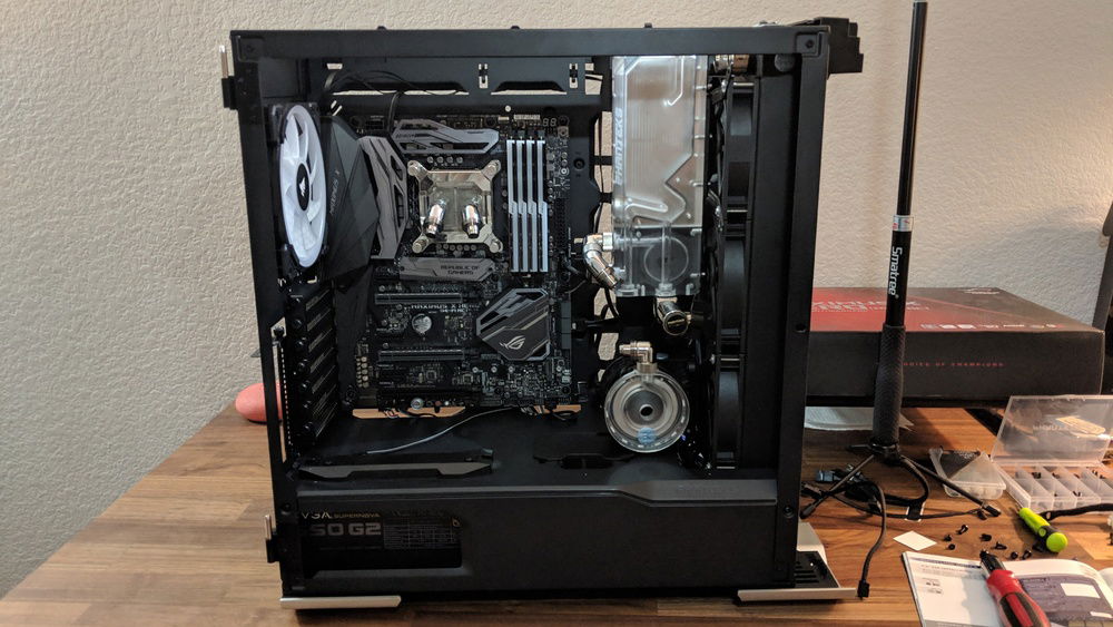 Phanteks and ASUS! Aura Sync and a silver and gold theme.