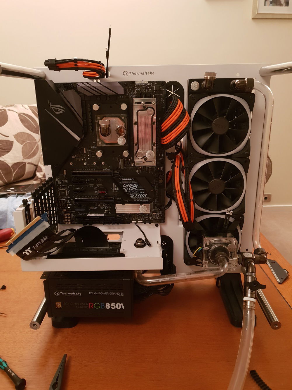Motherboard has been installed along with a EKWB heatsink, RAM block and CPU block. Figuring out placement for the new reservoir and starting to develop the loop