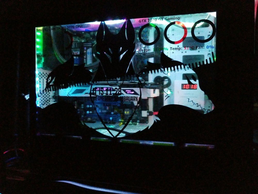 Side panel with sound reactive background and logo that matches a custom windows boot logo. Rainmeter HWinfo64 monitoring of GPU/ CPU/ RAM.