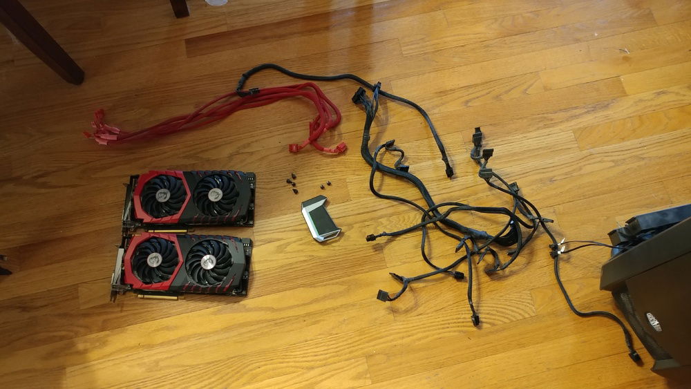 1080Tis and the original cabling mess from my Supernova 1000 G2. Ugly stock red PCIE cabling.