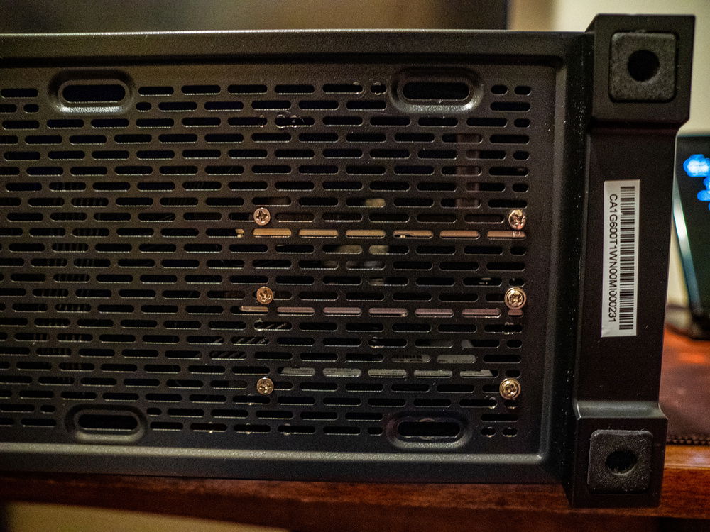 Improvised the mounting of the hard drives by using the venting grill on the bottom of the cage by screwing the hard drives to the case itself