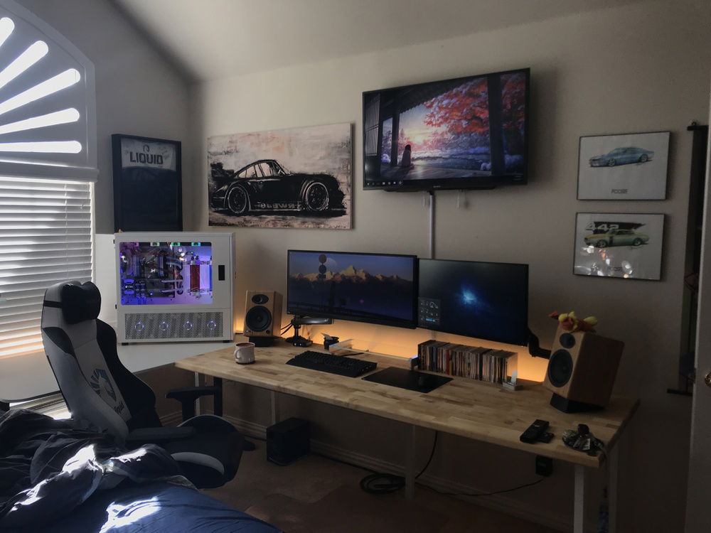 Another Photo of my setup, with pleasant lighting. This photo is slightly outdated as well, as I have since added one more monitor to my setup.
