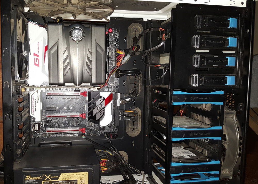 Installing the motherboard in the case. The power cable for the sound card is a royal pain to install because it keeps slipping off the connector and that's why I couldn't hide it