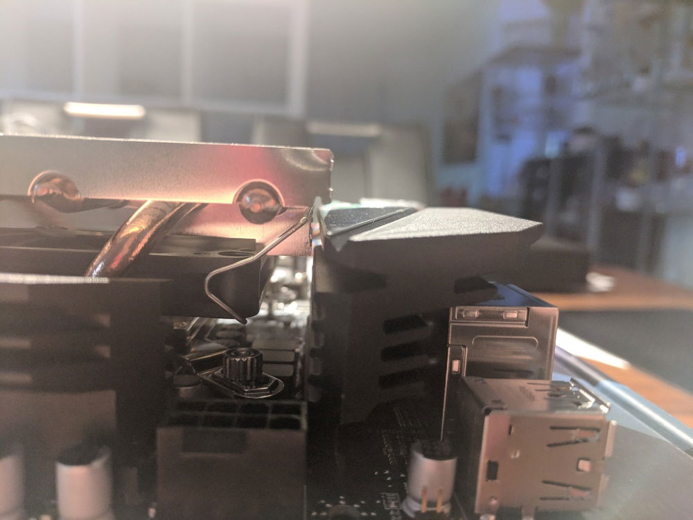 Just a tiny gap from CPU cooler to MB heatsinks.