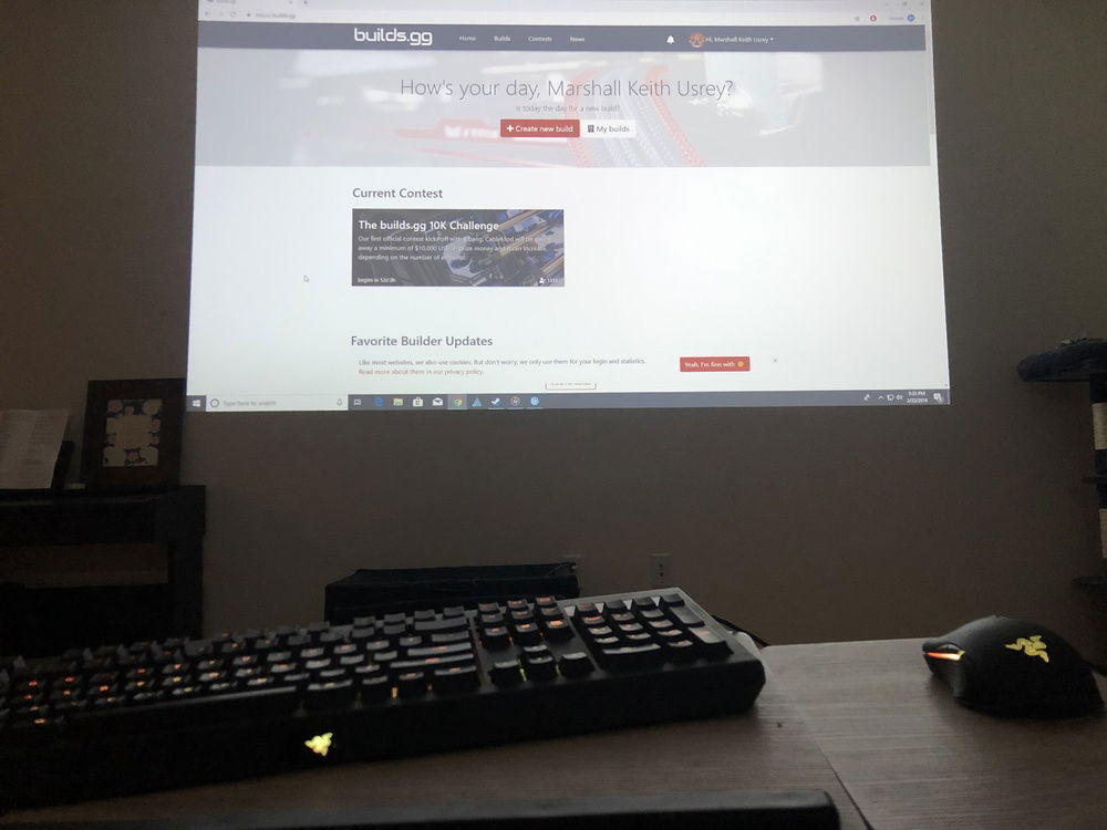 Here's my setup. Small apartment for now so no desk and no monitor. but the couch is comfy and the projector makes for an immersive view!