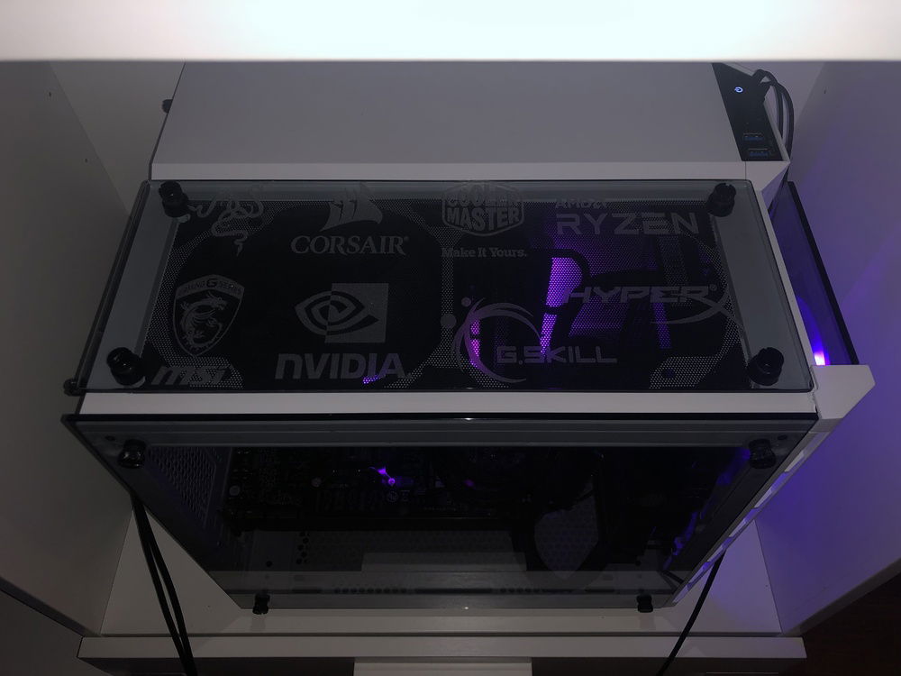 Here's the custom engraved top view panel as it is installed in the case. Had to turn off most the lighting to get a good image!