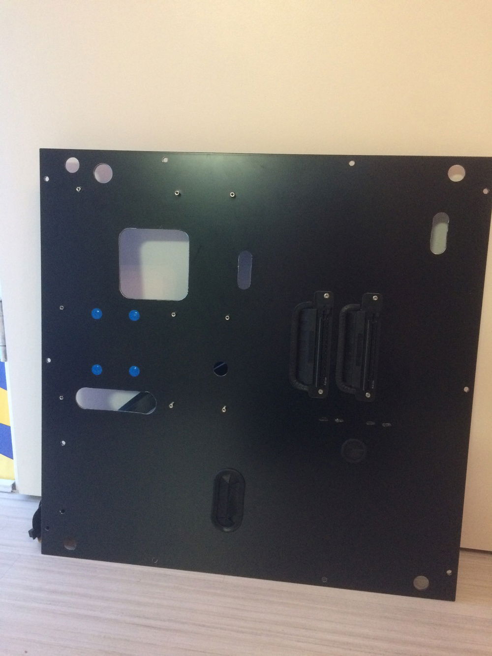 The second plate is correct :-) (The blue stickers is because the SSD is behind the plate/board)