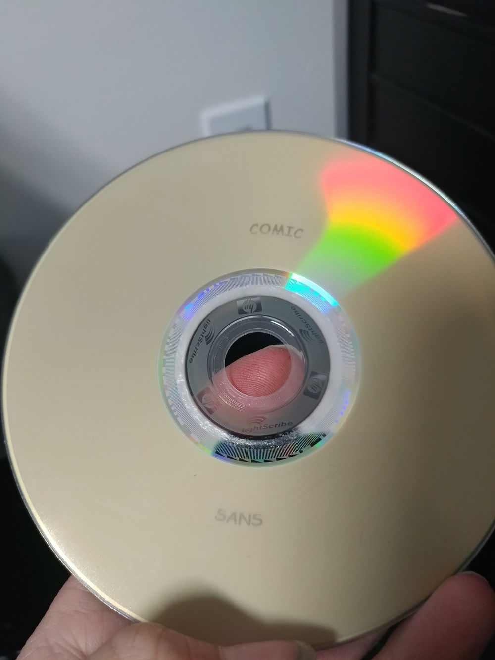 A blank DVD with the words "comic sans" engraved in comic sans, lightscribe yo