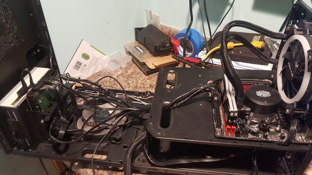 Case screws taken out and case folded out all the way to easily work inside.