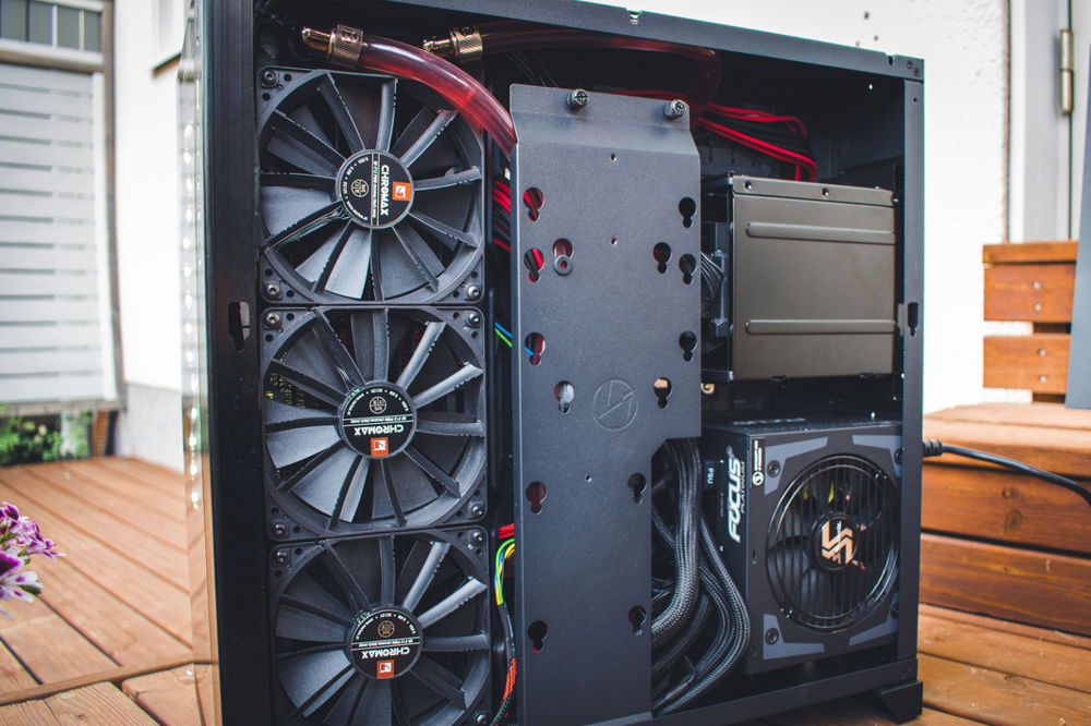 Soft tubing behind the motherboard.