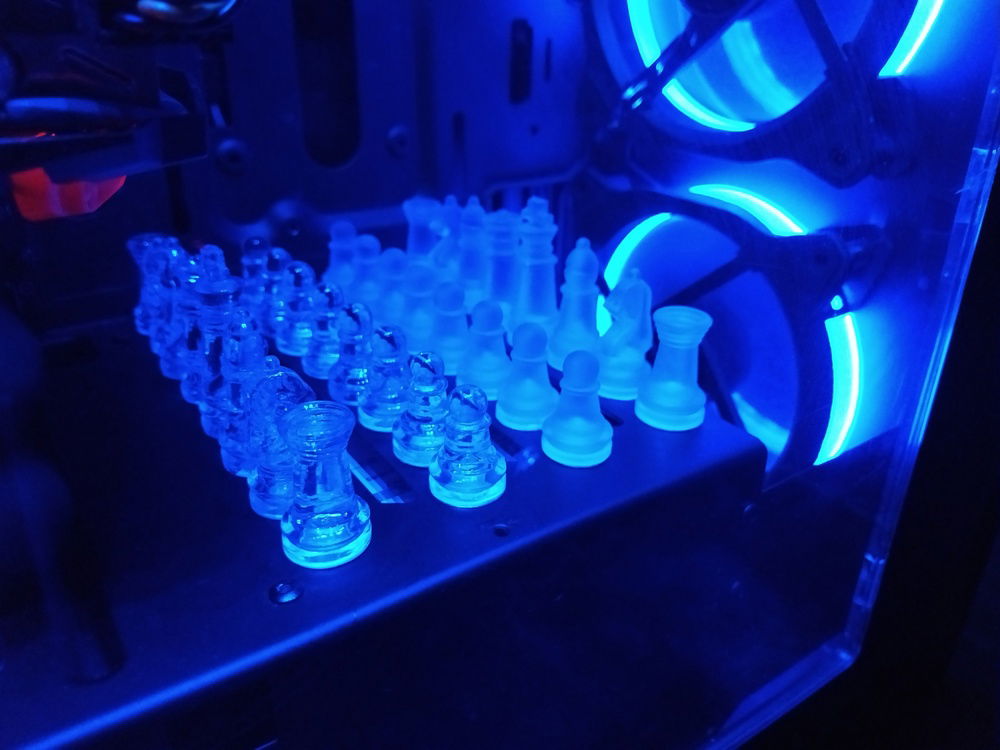 I love how the glass chess pieces glow from the blue light.