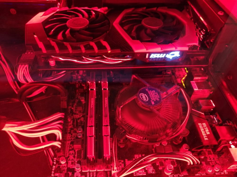 This picture is a close-up and shows my motherboard, ram cpu cooling fan and graphics card.