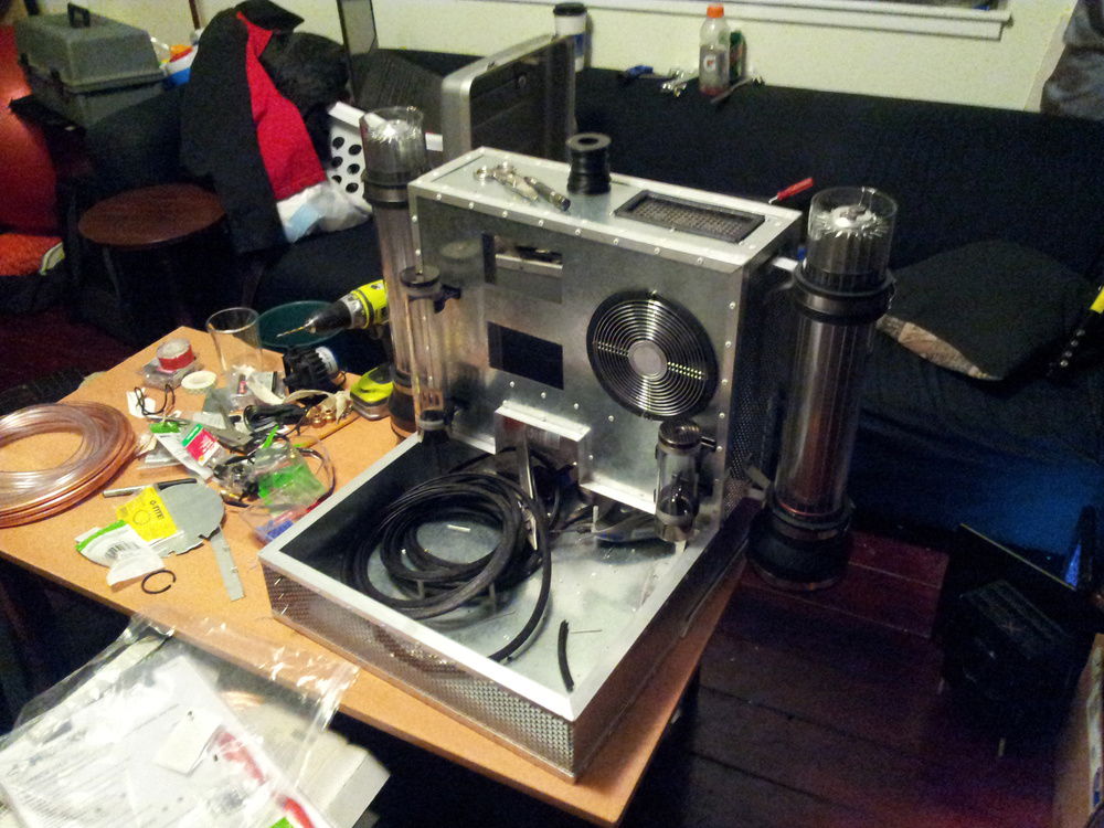 Cutting the openings for the fan control, TEC control, TEC cooling fan, heat duct, water ports, etc.