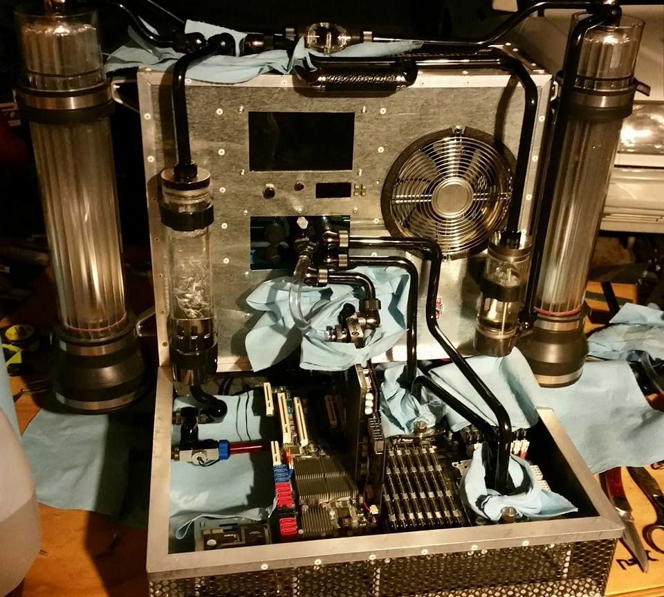 Leak test. I find blue shop towels show water better than most. Also worth noting is that switch under the TEC fan, slightly hidden by the CPU cooling tubes, which lets me flip the pump to a separate 12v power supply so I can do any loop maintenance without having to have any power to the system.