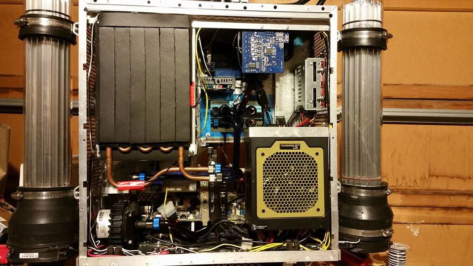 The interior from the rear. The TEC is covered in insulation with the controller the grey block right next to it. The drives are on the upper right, the blue card is the fan controller. I'm sure you can figure out the rest.