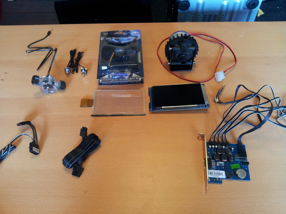 Cooling electronics laid out, including the disassembled above fan control unit.