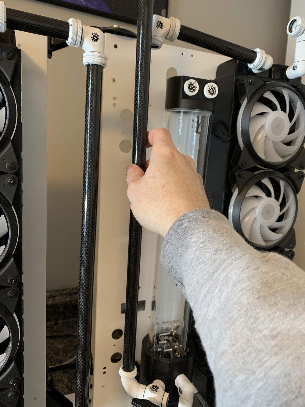 Measuring and marking the tube for cutting.