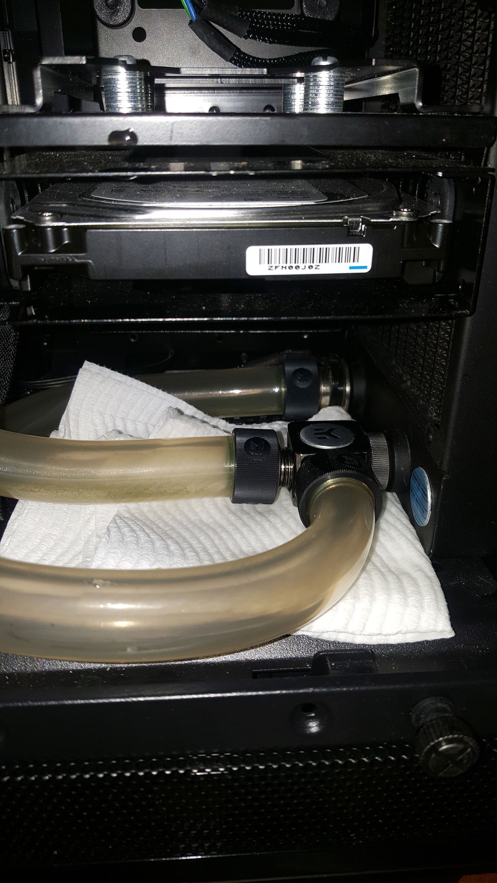 Tubes that are below the PSU shroud (used soft tubing for this) Front radiator and drain port. The soft tubing gets stained this dirty colour after about a years use