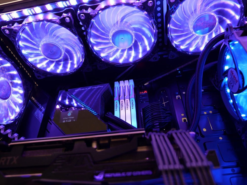 Cable routing for top mounted fans, also you can see how the fans transparent design allows for downward lighting spill to fill the top of the chassis providing illumination/visibility. Here I have a split color setup with purple and blue ( blue for the fans in the front and purple for the rest of the fans.