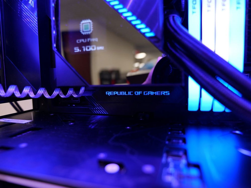 Close up of Ryujin CPU frequency monitoring as well as Republic Of Gamers RGB display on the motherboard