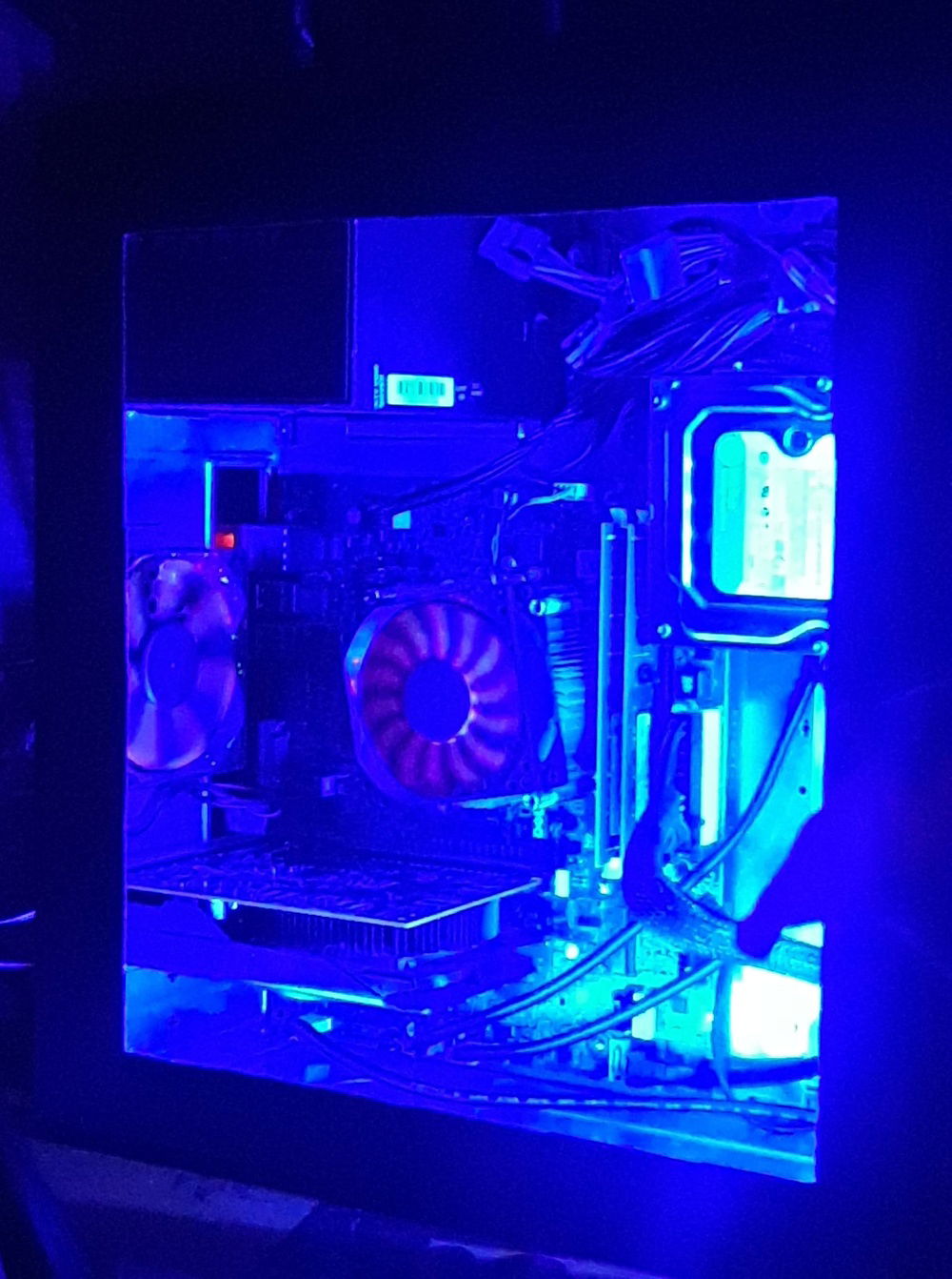I did all the work myself over a span of time.  including taking out stuff, making the open side, making a custom hdd mount, making my fans into fake rgb ;) (neon paint, bright rgb's reflect off of it giving it the spinning look.)