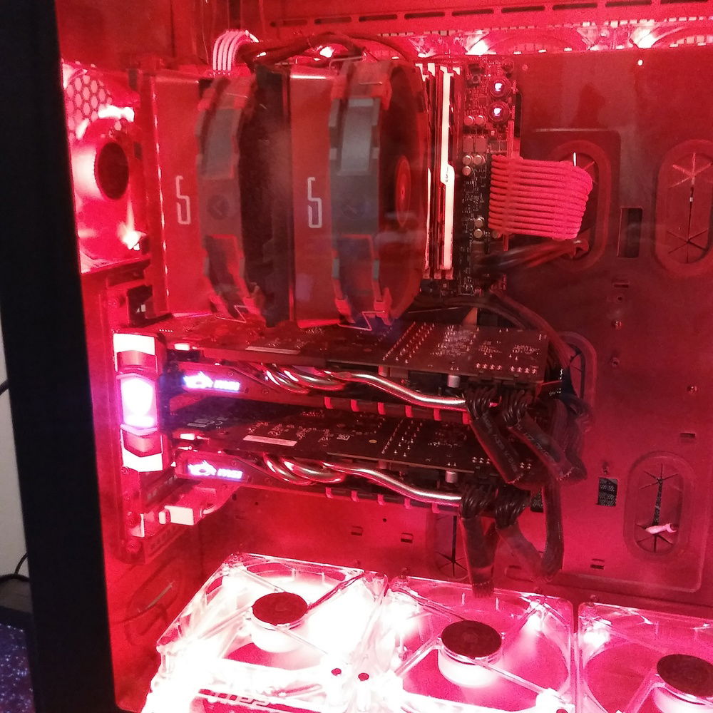 You can see here how I was able to route all 4 cables for the GPUs through one grommet to keep most of the excess length behind the motherboard tray, for a much cleaner look...