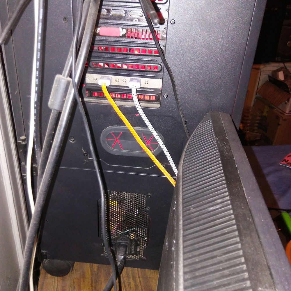 A view from the back showing the power supply mounting options, as you can see I went with using the P100, and it's a nice touch that Thermaltake has a cable passthrough on the cover plate on the position you don't use, would work well for V/R gear, which I don't have, but, it's nice to know it's there if I need it.