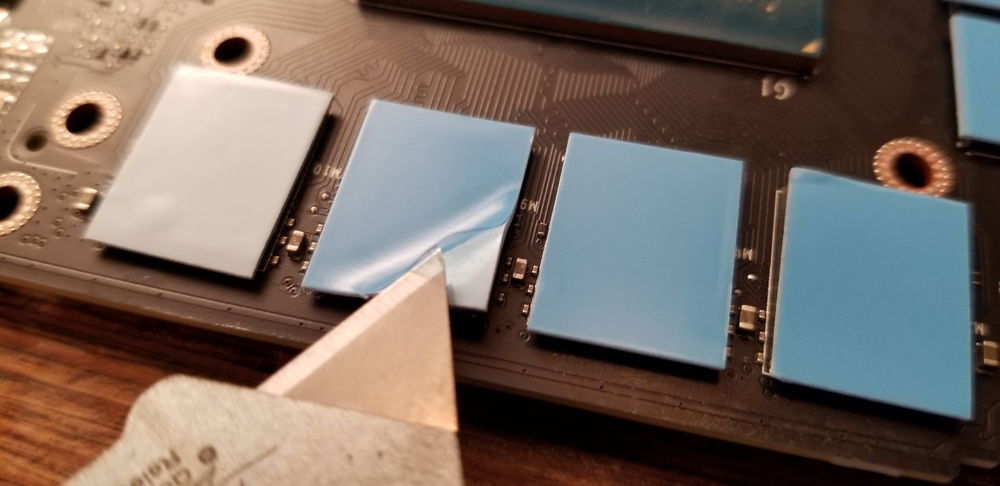 With the fit confirmed with the modded GPU water block it was time to get the thermal pads in place on the GPU. Using a razor blade and tweezers made removing the final layer of foil from the back of the new thermal pads MUCH easier.